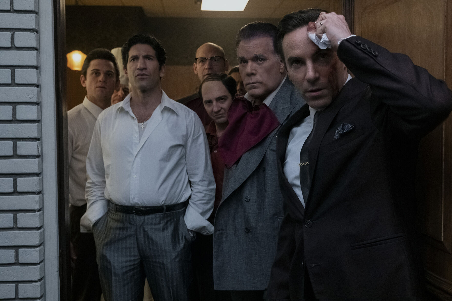 New faces for familiar characters in "The Sopranos" prequel "The Many Saints of Newark," from left: Billy Magnussen as Paulie Walnuts, Jon Bernthal as Johnny Soprano, Corey Stoll as Junior Soprano, John Magaro as Silvio Dante, Ray Liotta as "Hollywood Dick" Moltisanti and Alessandro Nivola as Dickie Moltisanti.